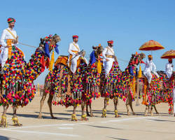 Image of realistic photo of colorful Rajasthan festival with camels and people in traditional attire