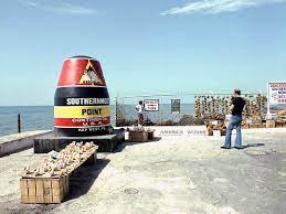 Tourist posing with southernmost point landmark in key west, florida. Southernmost Point In Key West Vereinigte Staaten Von Amerika Sygic Travel