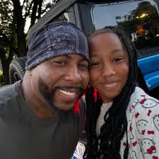 Pro wrestler "Double J" Jeff Jarrett ringing the bell.