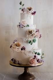 Wedding Cake Designer White With Textured Patterns And Pastel Roses Winifred Kr Cake Desi In 2020 Floral Wedding Cakes Gorgeous Wedding Cake Wedding Cakes With Flowers
