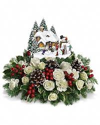 An instant christmas classic filled with family nostalgia, this festive arrangement of fresh blooms and winter greens accompanies a delightful thomas kinkade keepsake! Thomas Kinkade S Snow Time By Teleflora By Richardson S Flowers Gifts