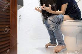 Asian Child Girl Sitting Defecating On Toilet Bowl In The Bathroom,people  Suffering From Constipation,sore Anus,diarrhea Or Hemorrhoids,stressed  Woman Feeling Painful Stomach,excretion Problem Concept Stock Photo,  Picture and Royalty Free Image. Image ...