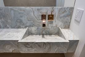 In other cases, especially with natural stones, the sink is a separate piece that the installer joins with the countertop onsite. Avalanche Quartzite Custom Integrated Powder Room Sink And Vanity Contemporary Powder Room San Francisco By Benattar Marble Granite