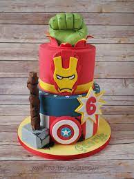 Starting with 9lbs of my ultimate vanilla cake dyed blue, red, maroon and yellow, these mini cakes are sure to save you from your cravings of cake! Marvel Heroes Birthday Cake Marvel Avengers Cake Avengers Birthday Cakes Marvel Cake