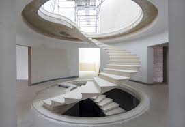 Normally you would jackhammer the old. See The Engineering Behind This Floating Award Winning Stone Helical Stair Archdaily