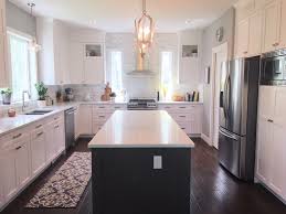 Farmhouse white kitchen cabinets with grey island. Things I Wish I Knew When Choosing White Shaker Kitchen Cabinets Valley Birch