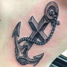 The anchor has also been engraved with the initial of the name to make it personal. 57 Anchor Cross Tattoos Collection