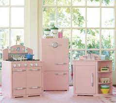 Complete with a sink, icebox and oven, it has a fun retro design with lots of interactive features like adjustable shelves, timers that tick and sign in to your registry with your pottery barn kids account. A Retro Pink Kitchen At Pottery Barn Too Bad It S For Kids Retro Pink Kitchens Pottery Barn Kid Kitchen Pink Retro Kitchen