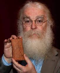 Professor Angus McDoo with the world's oldest sausage roll. It was found  behind a cupboard at St Andrew's university and is believed to be of an  ancient Pictish recipe. The professor apparently