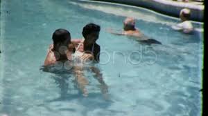People Swim Loving Couple In Swimming Pool 1960s Vintage Film Retro Home Movie Stock Footage Swimming Pool Couple People Vintage Film Swimming Home Movies