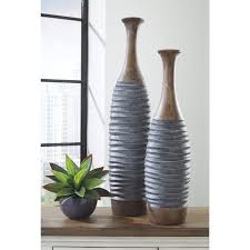 Stunning clear floor vase featuring an intricate design and shiny metal construction. Fireplace Vases Wayfair