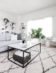 Black And White Living Room With A Marble Coffee Table In The Center Marble Table Ho Modern White Living Room Minimalist Living Room Cozy Living Room Design