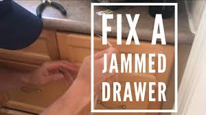 If there is a large object jammed inside the drawer, use a long, thin dinner knife or other dull item, such as a metal ruler, to gently jiggle the item back into place so that the drawer can open freely. Easy Fix For A Stuck Kitchen Drawer Youtube