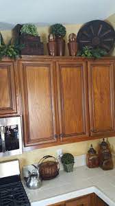 You can decorate the space above your kitchen cabinets using tall pieces especially if you have high ceilings. Tuscan Decor Decorating Above Kitchen Cabinets Kitchen Cabinets Decor Tuscan Decorating Kitchen