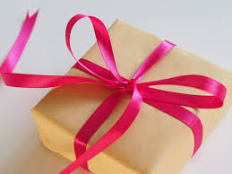Gift meaning, definition, what is gift: Person Showing Brown Gift Box Photo Free Christmas Image On Unsplash