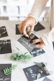 Spiff up your turkey day dinner table with one of these crafty ideas. Simple Fall Place Cards With Fresh Greenery Diy Lauren Saylor Stationery Interiors Design