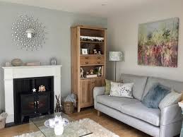 In this bright and airy living room space the wall lights are placed directly above the skylight which floods the. Skylight