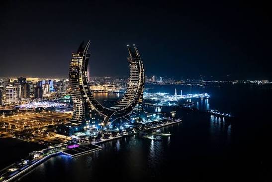Contemporary illuminated bridge over calm water