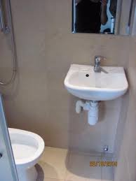 tiny 'sink / shower / toilet' all in