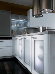 A Contemporary Two Tone Kitchen Under A Loft Glass Kitchen Cabinets Kitchen Design Modern Kitchen