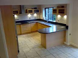 The double doors that once led out to the sunroom have been blocked to install a timber window above the sink, and the sun room is now a utility room. Kitchen Layout Small Kitchen Diner Kitchen Remodel Small
