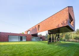 Maybe you would like to learn more about one of these? Structure Cantilevers Over The Garden Of A Polish House