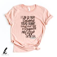 We release new designs every month so that you will always have the newest and most unique bad bunny merch available! I Can Go From Selena To Bad Bunny To Backstreet Boys To Paquita And Lizzo En Un Dia Shirt Karla And Co