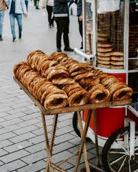 Simit on the go in the heart of Istanbul. If a pretzel had a food child  with a bagel this would be it. These things are bussin and they are  everywhere you