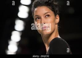 Model Rebecca Mir walks the runway at the Riani show during the  Mercedes-Benz Fashion Week Berlin Spring