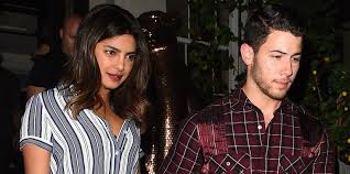 Chopra wore a royal blue and gold dress with a giant diamond necklace Finally We Got To See Priyanka Chopra S Engagement Ring From Nick Jonas