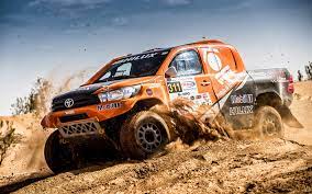 download wallpapers toyota hilux 2018 dakar rally desert sand racing cars toyota besthqwallpapers com toyota hilux race cars rally car
