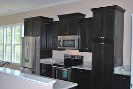 This guide will help you find the right hue to pair with oak cabinets. Black Stained Kitchen Cabinets Home Furniture Design Black Kitchen Cabinets Kitchen Cabinets For Sale Stained Kitchen Cabinets