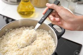 New york times food columnist mark bittman used to look down on the microwave for any sort of cooking beyond reheating leftovers or softening ice cream. Woman Cooking Rice On Stove In Kitchen Closeup Stock Photo Picture And Royalty Free Image Image 116631001