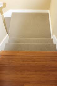 Pulling carpet up from stairs. Carpeted Stairs Leading Into Hardwood Laminate Hallway Carpet Stairs Wood And Carpet Stairs Bamboo Flooring