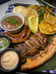 Bandeja Paisa with skirt steak, Colombian chorizo, and chicharrón :  rFoodPorn