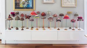 Display of tea cups in vintage looking framed wall display. How To Display Collections In Your Home Real Homes