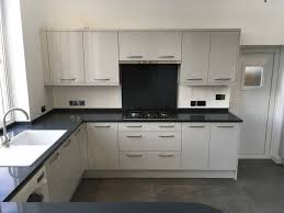 Reviewing kitchen pictures and photos are a great way to get a feel for different kitchen layouts and help you decide what you want. Light Grey Gloss Kitchen With Charcoal Soapstone Worktops Modern Kitchen Oxfordshire By Precision Kitchens Houzz