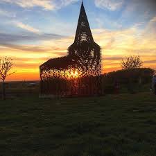 Je ziet overduidelijke contouren van een kerk. Doorkijkkerkje Borgloon Limburg Photograph By Sarah Karipidis