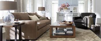 A sofa with end tables along side of it is flanked by two chairs to form the main conversation area. Living Room Layouts How To Arrange Furniture Crate And Barrel