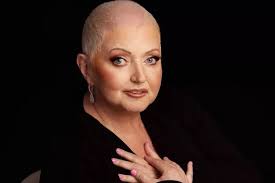 Irish singer Linda Nolan dies with famous sisters holding her hand until  very end