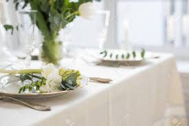 Former editor robert rufino takes the stress out of setting a formal table and shows us the basics that define proper etiquette. Beautiful Festive Table Setting With Elegant White Flowers And Cutlery Dinner Table Decoration Stock Photo Picture And Royalty Free Image Image 117232346