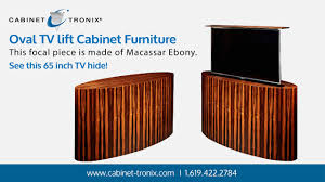 Factory direct handcrafted pop up tv lift cabinets. Macassar Ebony Oval Tv Lift Cabinet Hides 65 Inch Flat Screen Youtube