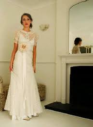 The bodice and sheer sleeves with appliqued daisies are a particular feature of this gown. Transparent Sleeves And Neckline 1930 S Wedding Dress Vintage Bridesmaid Dresses Vintage Style Wedding Dresses Wedding Dresses Uk