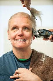 24424671-Photograph by Ian Georgeson Three teachers from dummond High  School have there head shaved to raise over £2000 for Macmillan cancer  support, Hairdresser Elaine Glendinning shaves Derek Shark