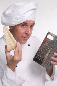 Chef Holding A Slice Of Parmesan Cheese And A Cheese Grater Stock Photo,  Picture and Royalty Free Image. Image 22766981.