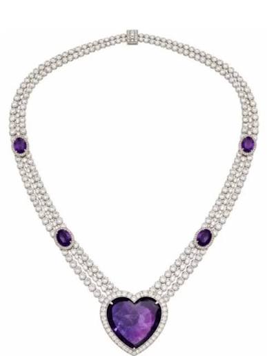 Princess of Wales Kate Middleton wore Queen Mother's Amethyst necklace with  a heart shaped amethyst pendant with a multi strand diamond & pearls  detailing. The blue Sapphire engagement ring of Princess Kate