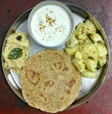 The Fasting Thali Potatoes Yam Banana Raita And Rajgira Roti Amaranth Flour This Is A Very Basic Meal Consumed During A Fas Purple Yam Food Curry Leaves