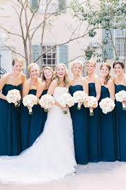 The best blue wedding flowers (and 16 gorgeous blue bouquets). Bride And Bridesmaids Navy Bridesmaids Dresses Flowers By Tara Guerard Soiree Fall Bridesmaid Dresses Blue Bridesmaid Dresses Blue Bridesmaids