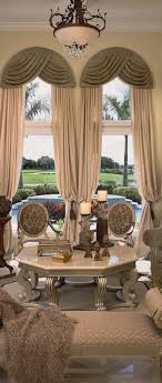 If you want to enhance the shape of the window, decorative pegs can be placed above the frame of the arch where the curtains can hang. Astonishing Window Treatments For Large Windows In Living Rooms Home Ideas Hq