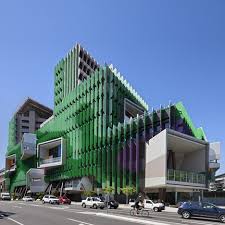 Hospital By Lyons And Conrad Gargett Features A Vibrant Facade And A Tree Inspired Layout Hospital Architecture Colour Architecture Healthcare Architecture